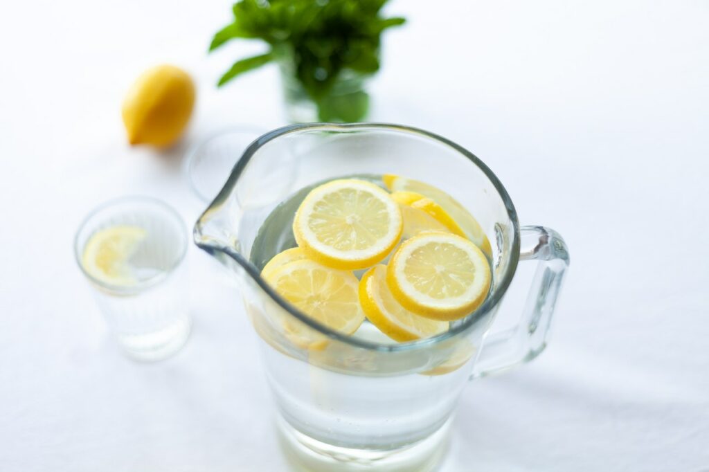 a pitcher of refreshing filtered tap water with lemon slices